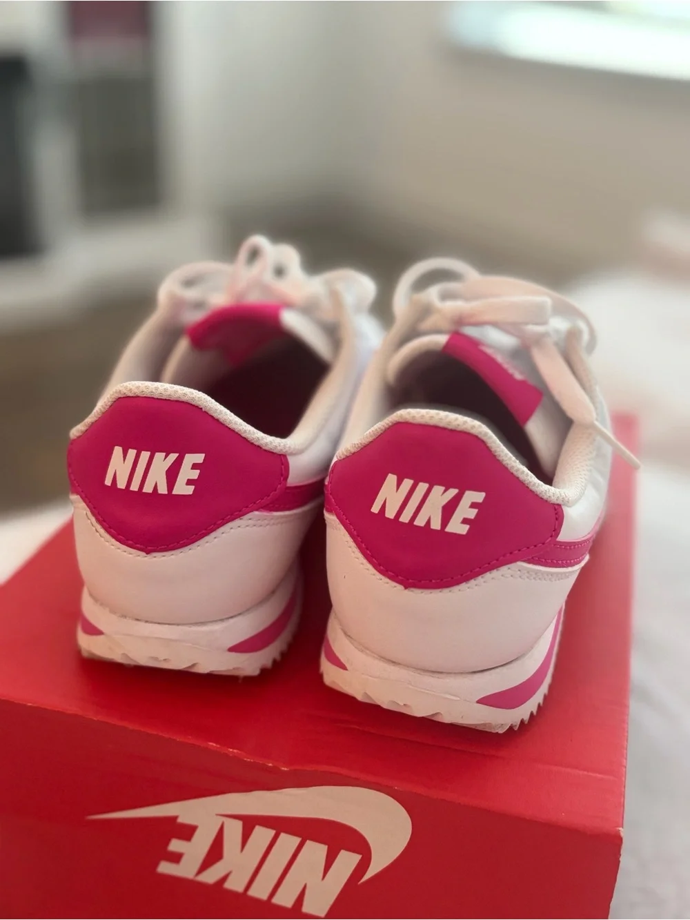Nike White Sneakers with Pink Swoosh